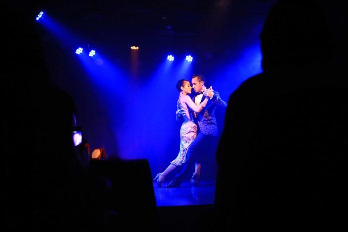 A Tango dance in a blue-lit room